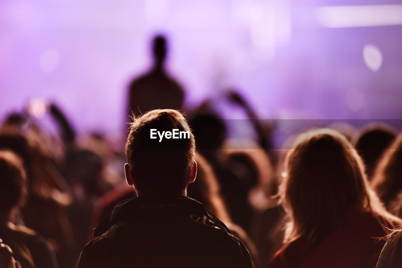 Rear view of crowd enjoying during concert