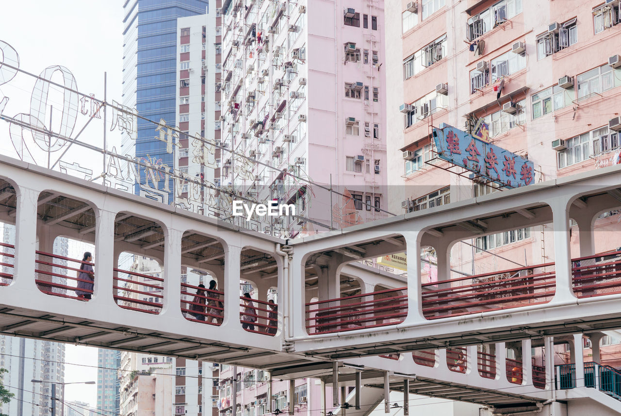 LOW ANGLE VIEW OF TEXT ON BUILDING AGAINST SKY