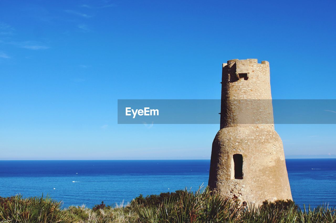 Scenic view of sea against blue sky