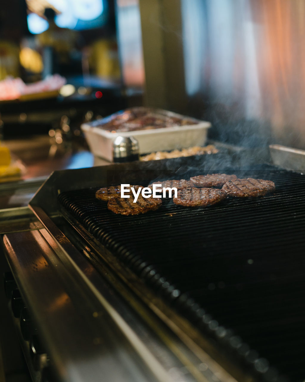 CLOSE-UP OF MEAT ON BARBECUE