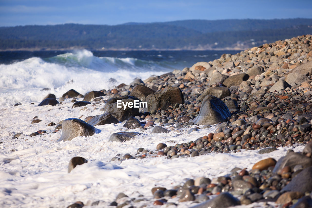 Surf reaching on shore at beach