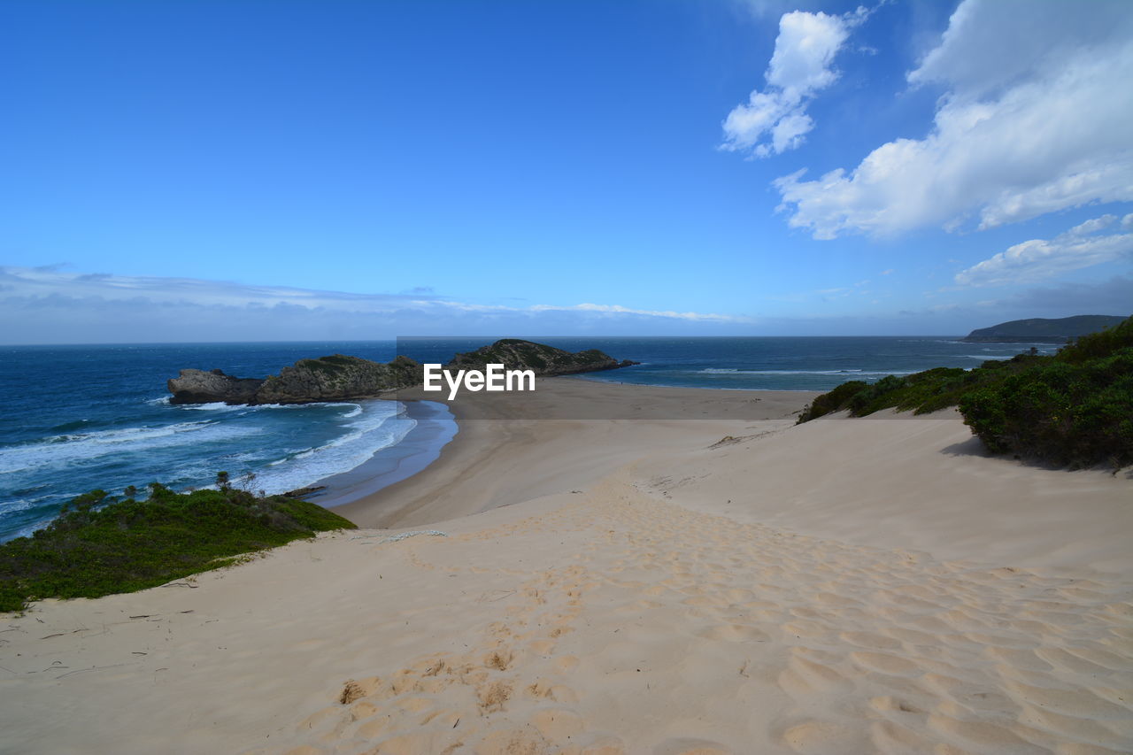 Scenic view of beach against sky