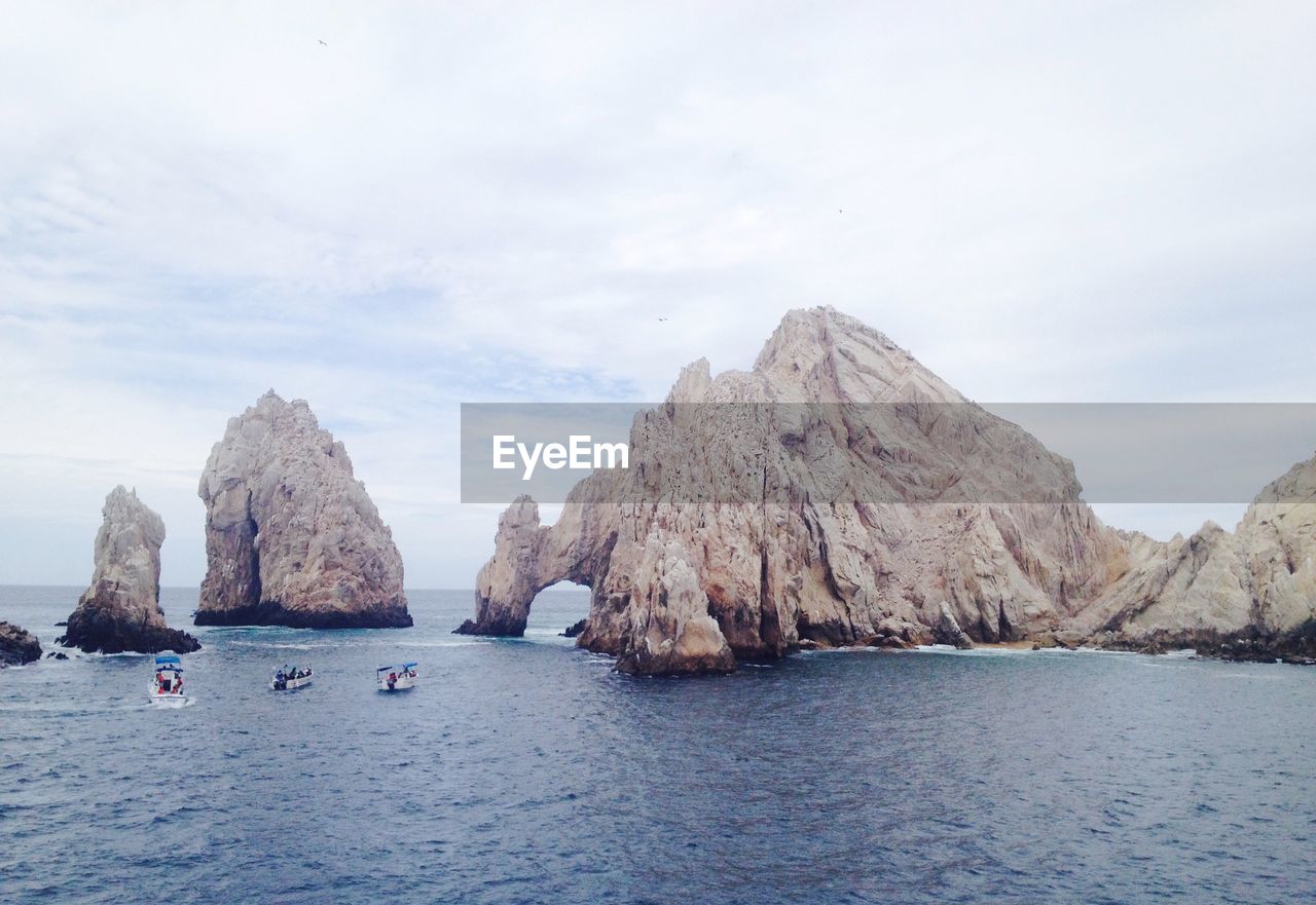 Panoramic view of sea and mountains against sky