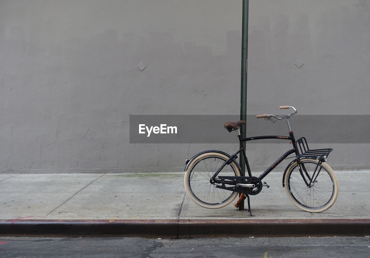 BICYCLE PARKED ON WALL