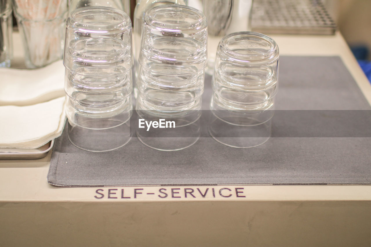 HIGH ANGLE VIEW OF EMPTY DRINKING GLASS ON TABLE