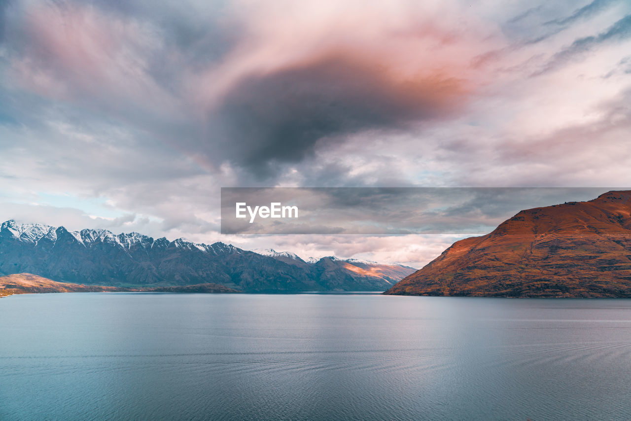 Scenic view of lake against sky during sunset