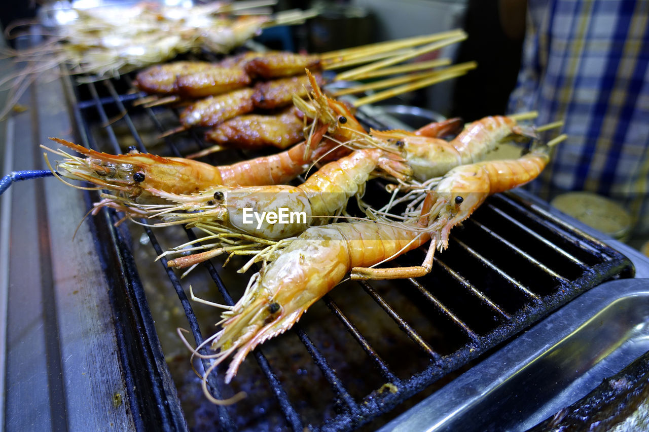 CLOSE-UP OF SEAFOOD ON BARBECUE