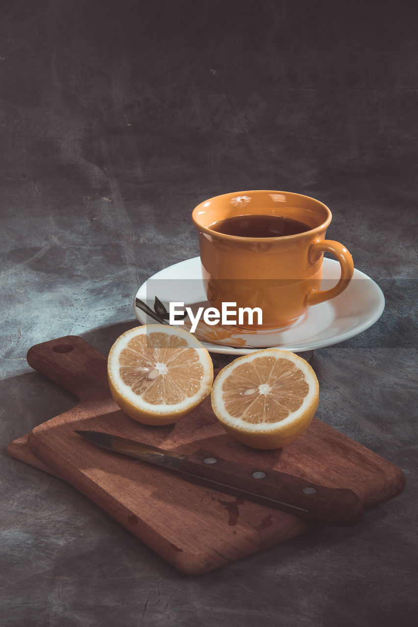 COFFEE CUP AND TEA ON TABLE