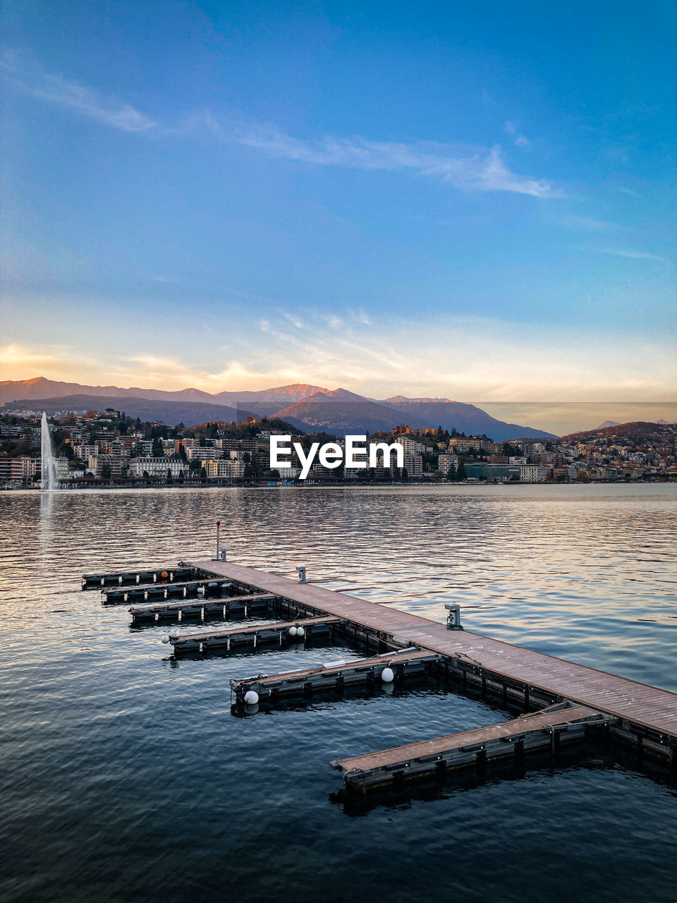 Scenic view of lake against sky at sunset