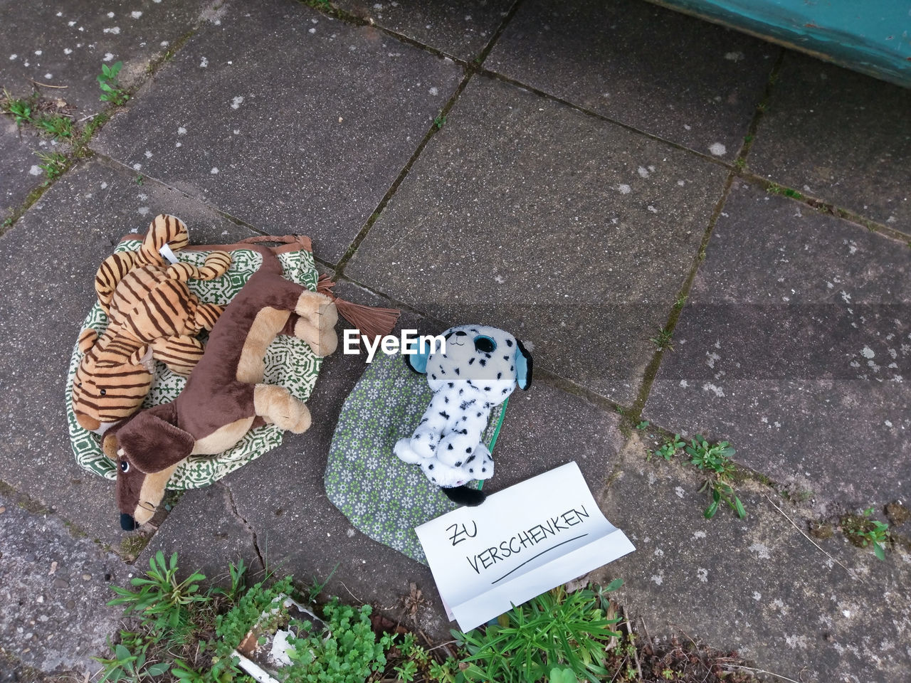 HIGH ANGLE VIEW OF TOYS ON STREET