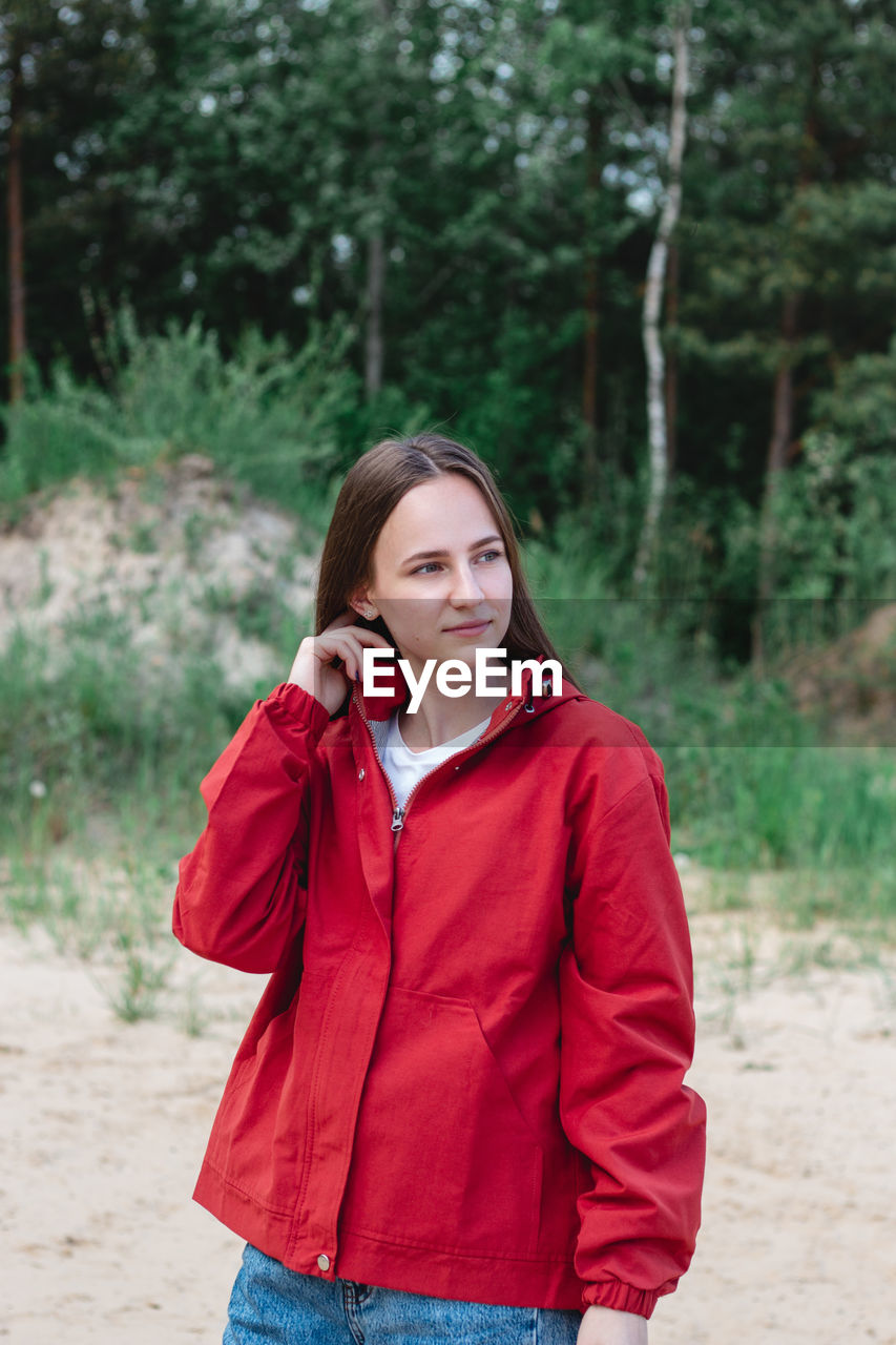 Candid portrait of a young caucasian woman at the beach