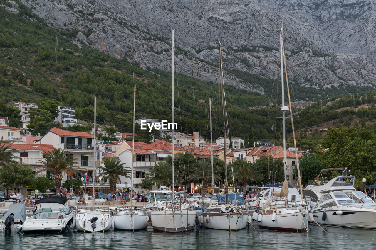 Boats moored at harbor