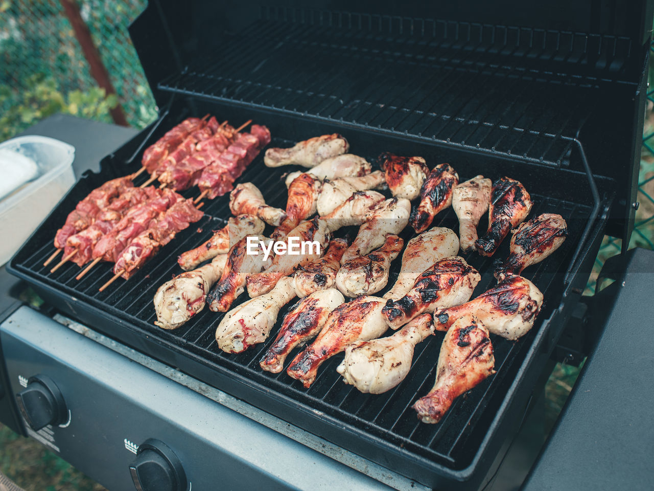 High angle view of meat on barbecue grill