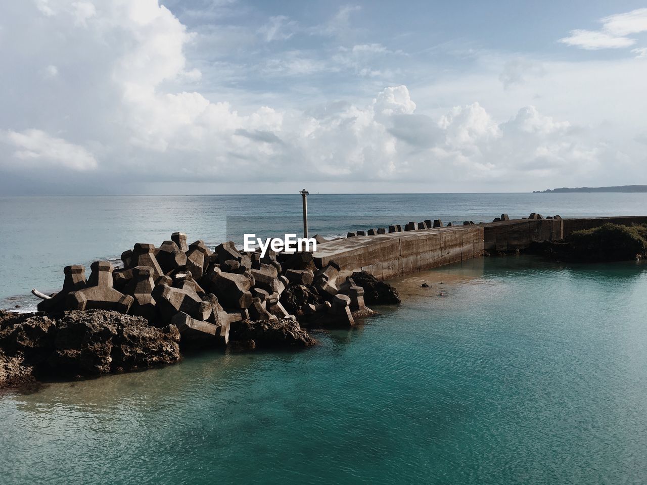 PANORAMIC VIEW OF SEA AND ROCKS AGAINST SKY