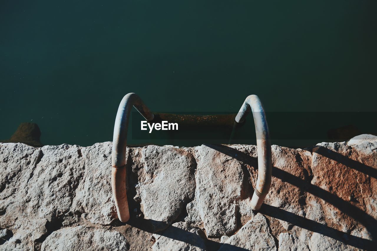 High angle view of railing by pool