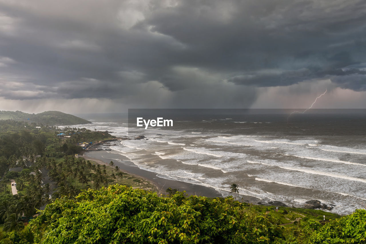 Scenic view of the sea against storm clouds