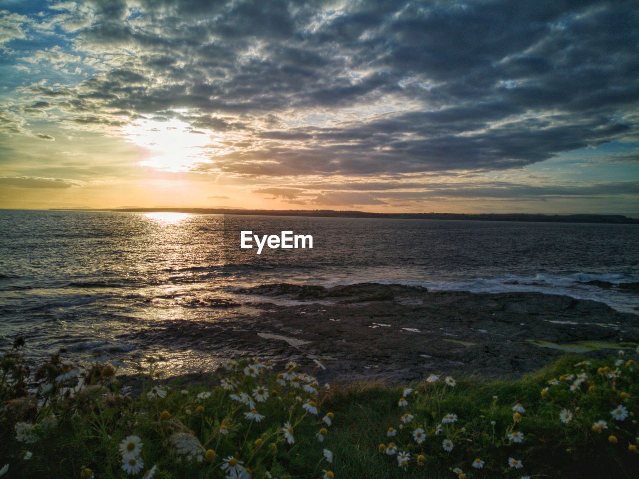 Scenic view of sea against sky during sunset