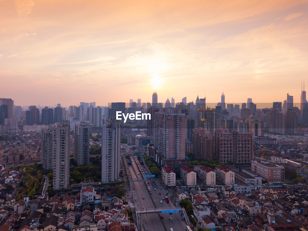 High angle view of buildings in city against sky during sunset