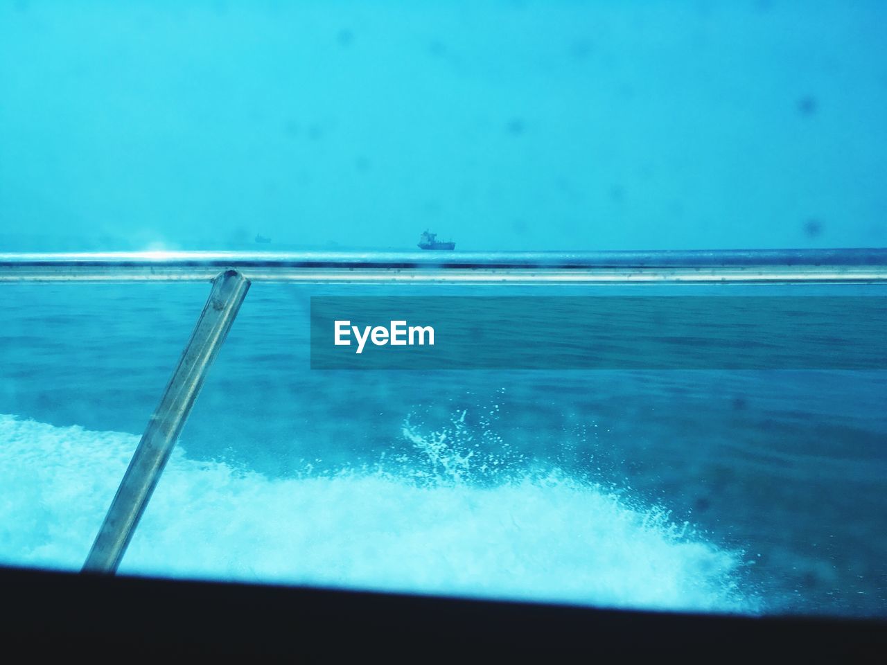 VIEW OF CALM BLUE SEA AGAINST SKY