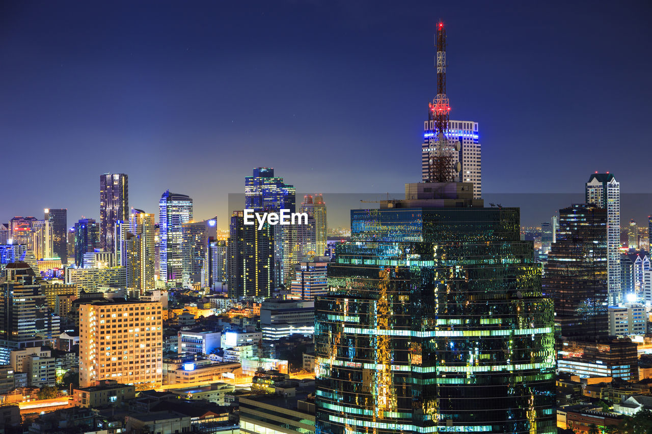 Illuminated buildings in city at night