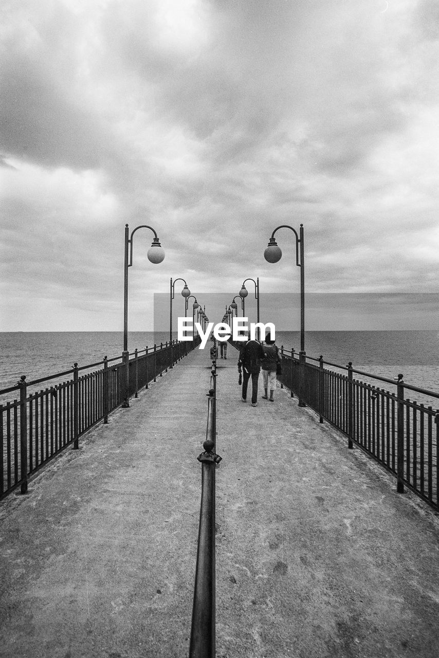 VIEW OF PIER OVER SEA AGAINST SKY