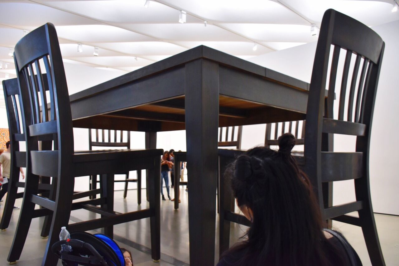 REAR VIEW OF GIRL ON FLOOR