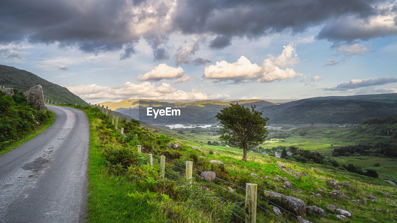 PANORAMIC SHOT OF ROAD AMIDST LANDSCAPE AGAINST SKY