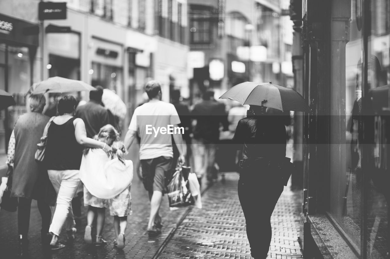 WOMAN WALKING ON CITY STREET