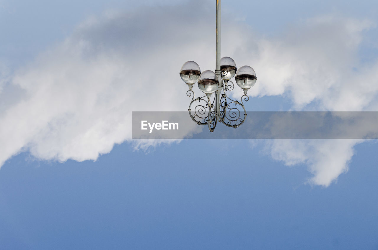 LOW ANGLE VIEW OF LAMP AGAINST SKY