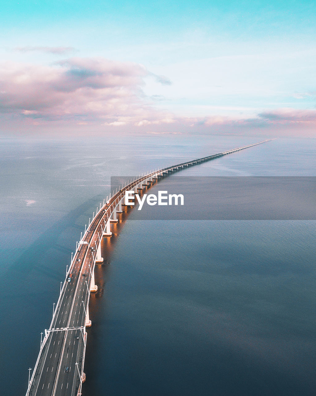 Aerial view of bridge over sea against sky