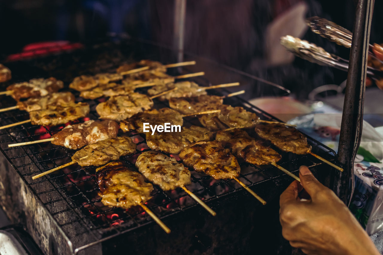 High angle view of meat on barbecue grill