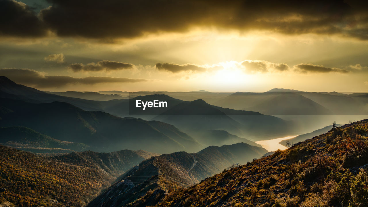 Scenic view of mountains against sky during sunset