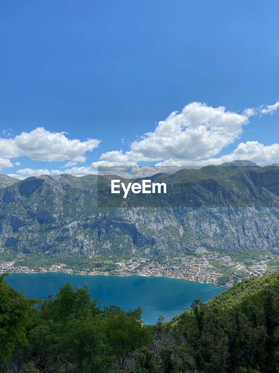 high angle view of townscape by mountains against sky