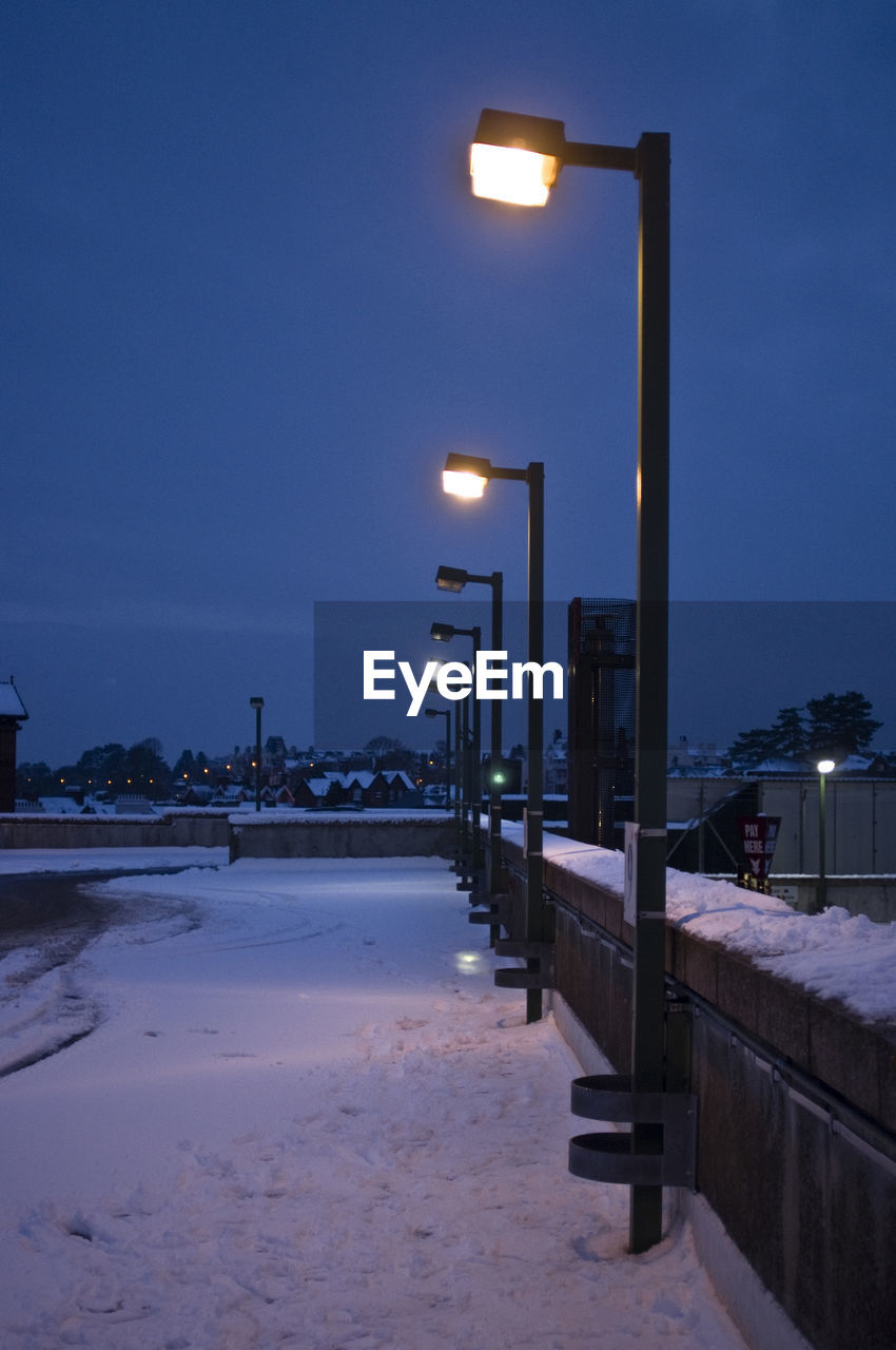 Row of illuminated street light during winter