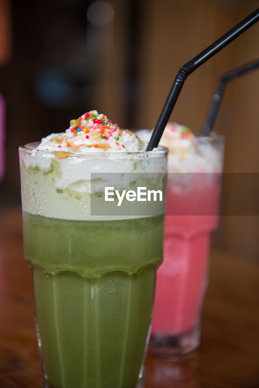 Close-up of drink glasses on table