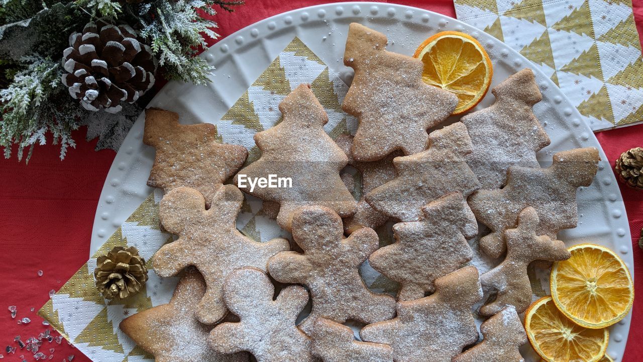Directly above shot of gingerbread cookies in plate on table during christmas