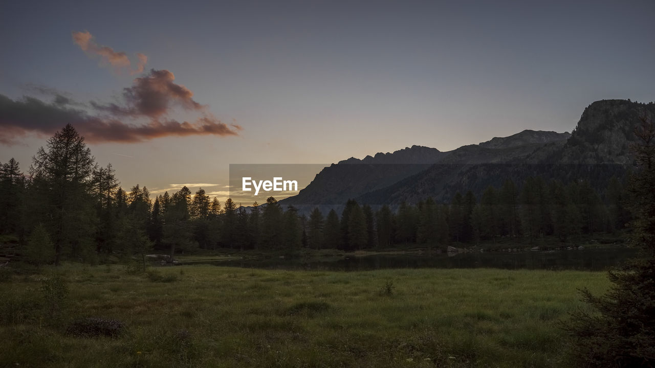 Scenic view of landscape against sky during sunset