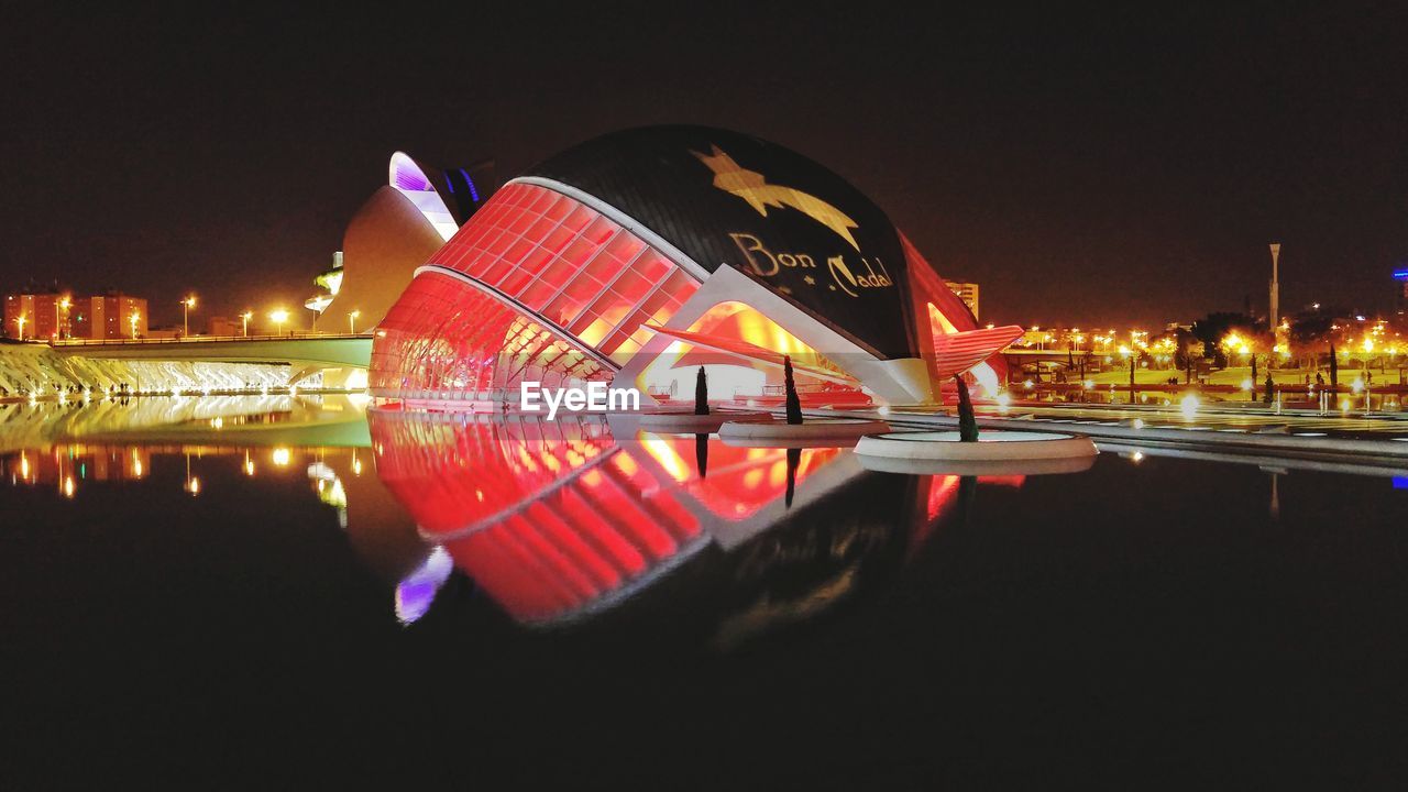 REFLECTION OF ILLUMINATED BUILDINGS IN WATER