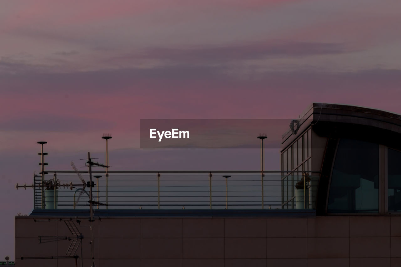 Low angle view of building against sky during sunset