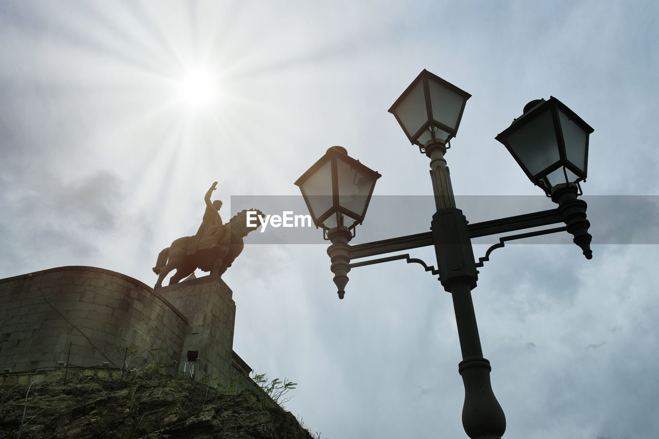 LOW ANGLE VIEW OF STREET LAMP AGAINST SKY