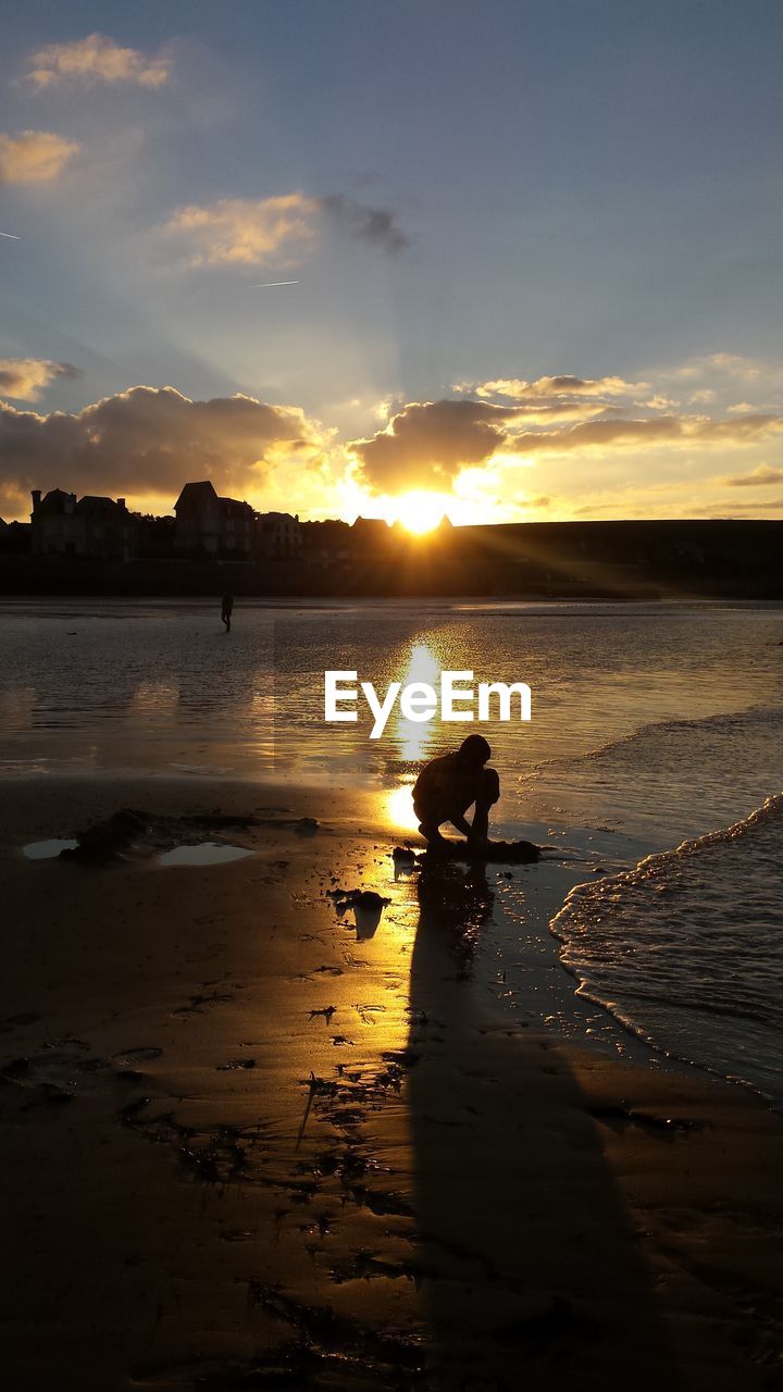 View of beach against sky during sunset