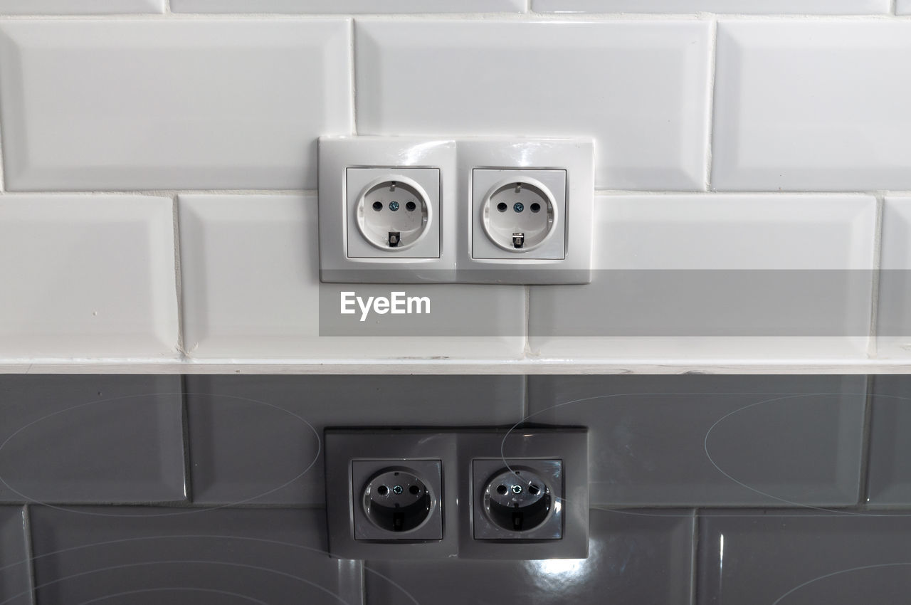 Close-up of electrical outlet on wall