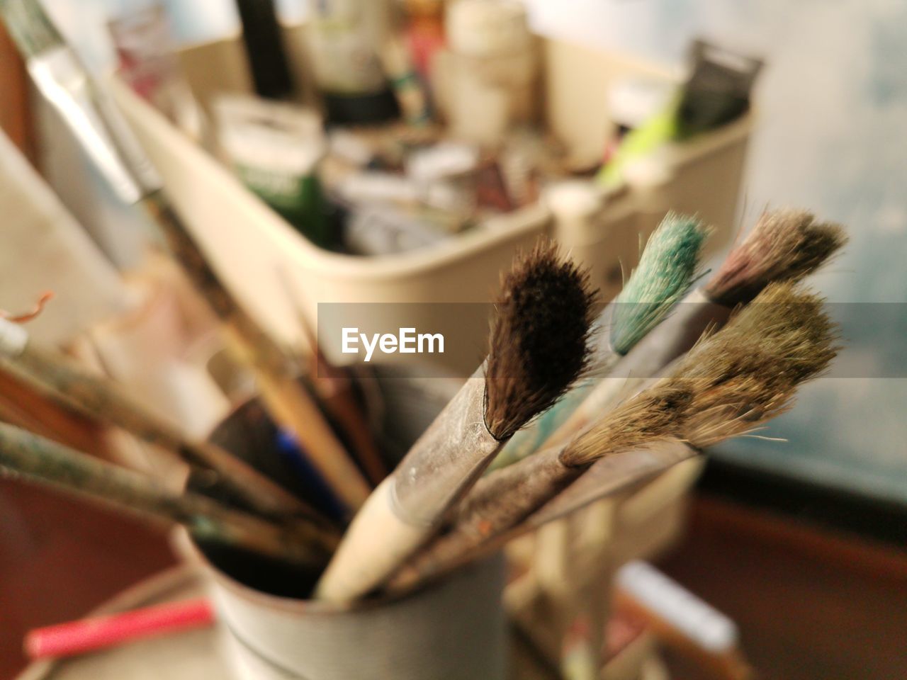 Close-up of paintbrushes on table