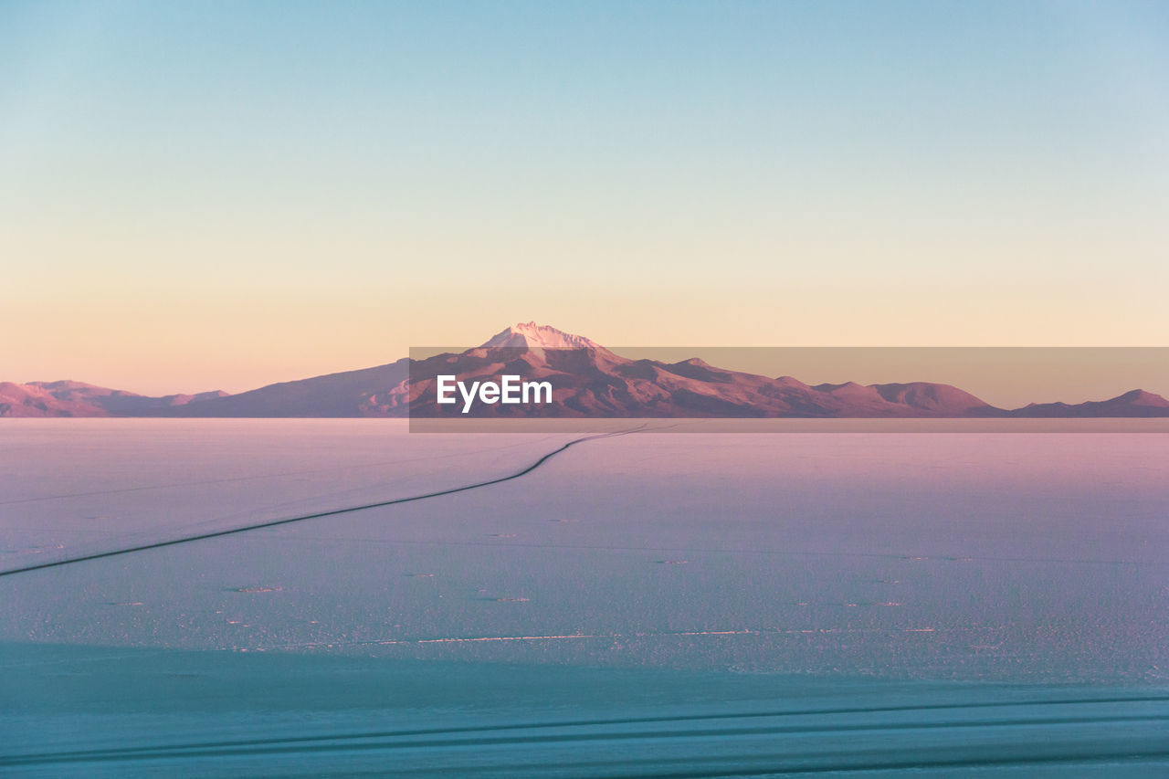 The sun goes down in the salt desert of bolivia