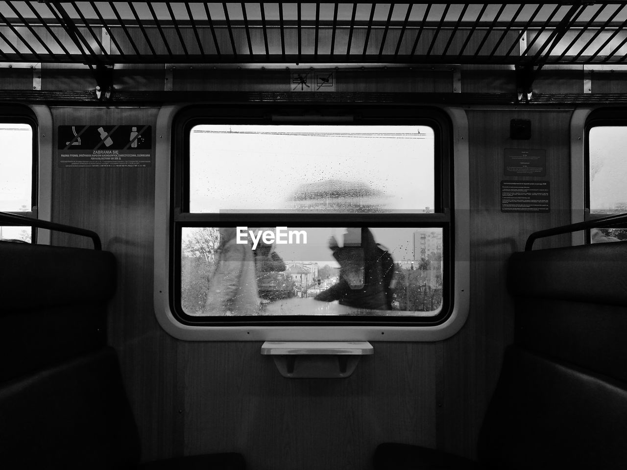 Wet window in train during rainy season