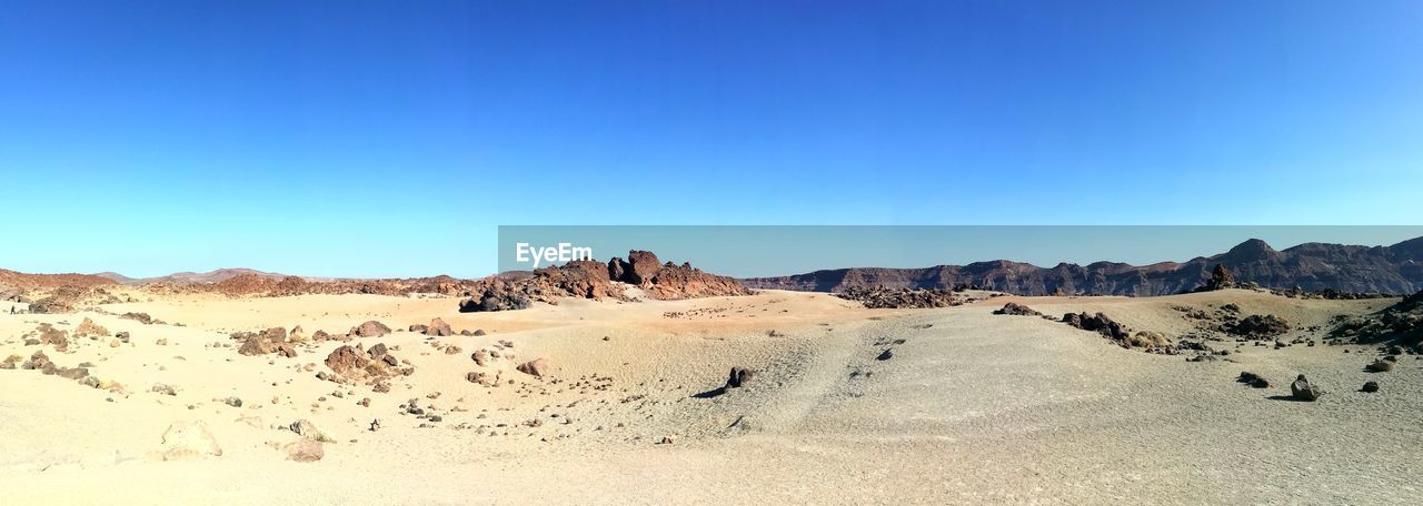 VIEW OF DESERT AGAINST CLEAR BLUE SKY