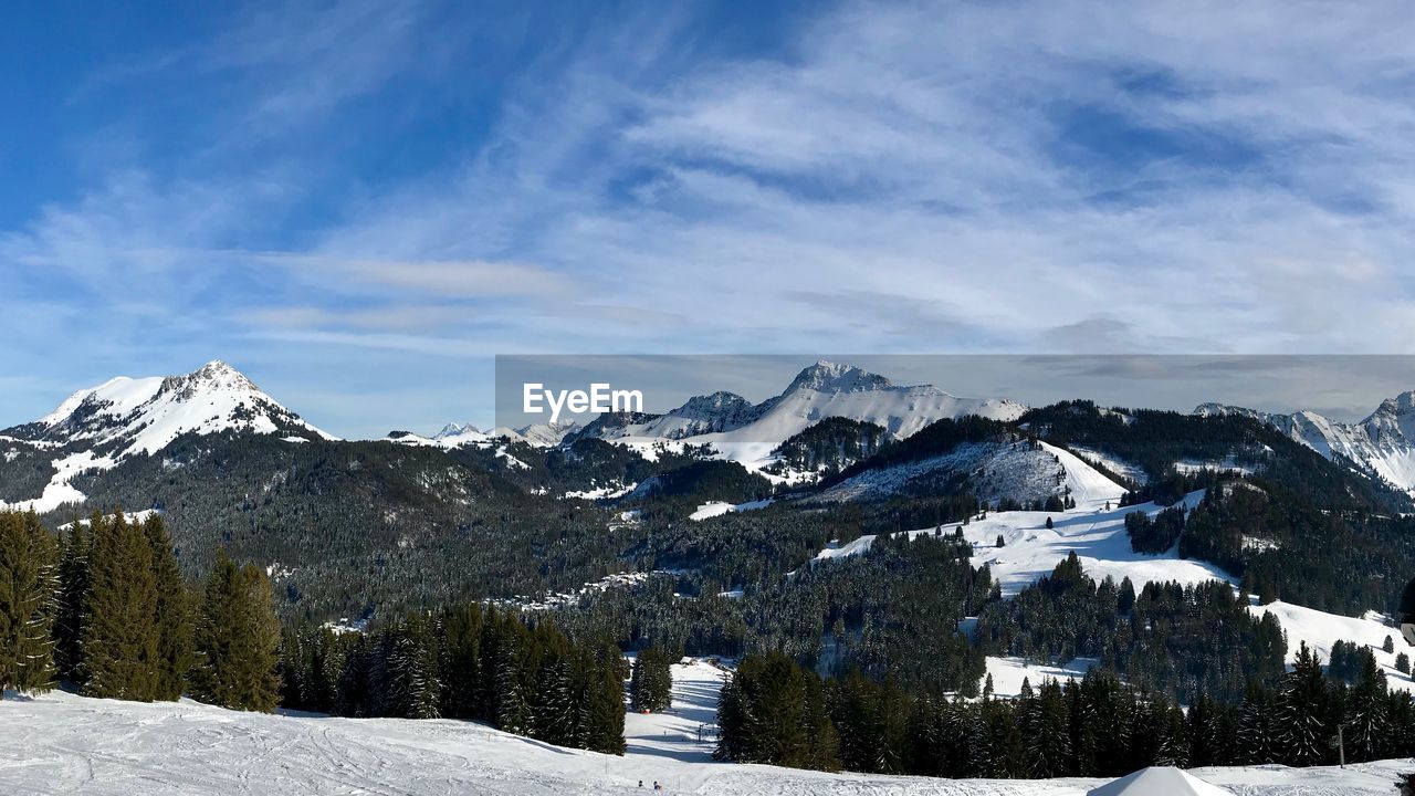 Scenic view of snowcapped mountains against sky