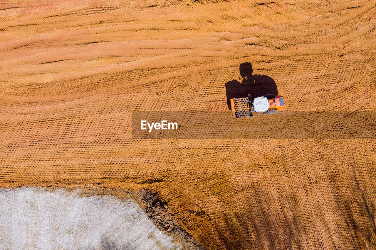 high angle view of man walking on field