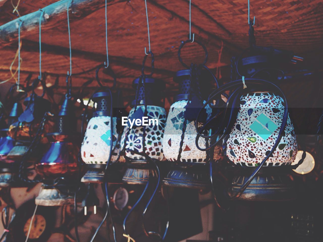 Colorful lanterns handing from bamboo