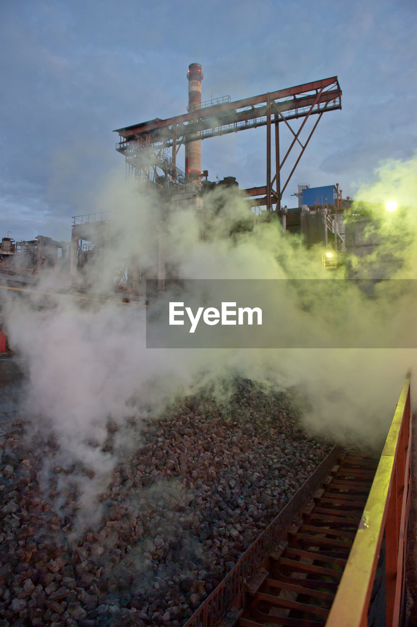 Smoke over gravels at altay koks factory